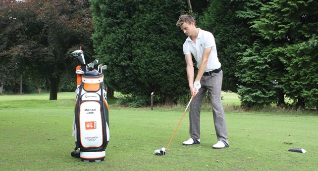 Michael Lane, golfer, preparing to take a swing of his golfclub